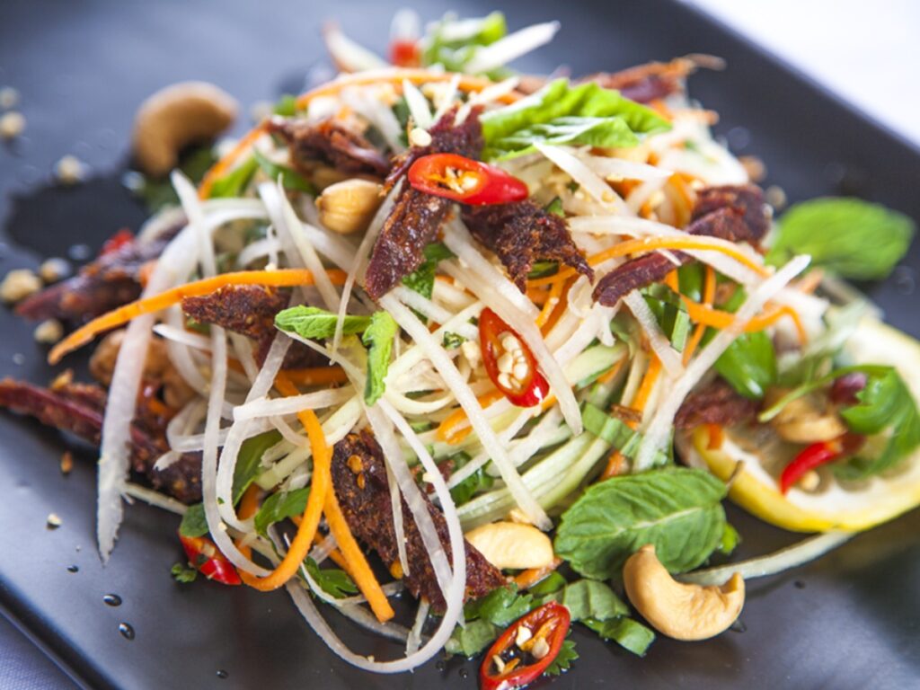 19 BEST local food in Hanoi that you MUST try once! 15 Green papaya salad with Beef Jerky - 19 BEST local food in Hanoi that you MUST try once!