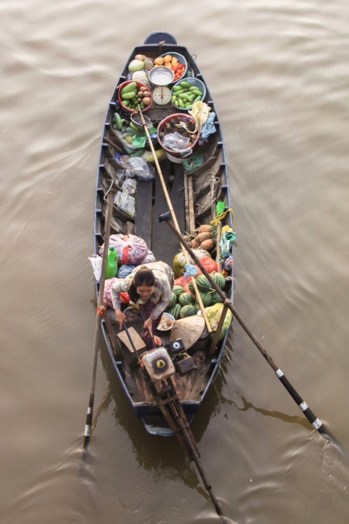 12 Best Places In Vietnam | Bucket List Destinations 2024 10 A boat in the early morning Phong Dien floating market 1 - 12 Best Places In Vietnam | Bucket List Destinations 2024