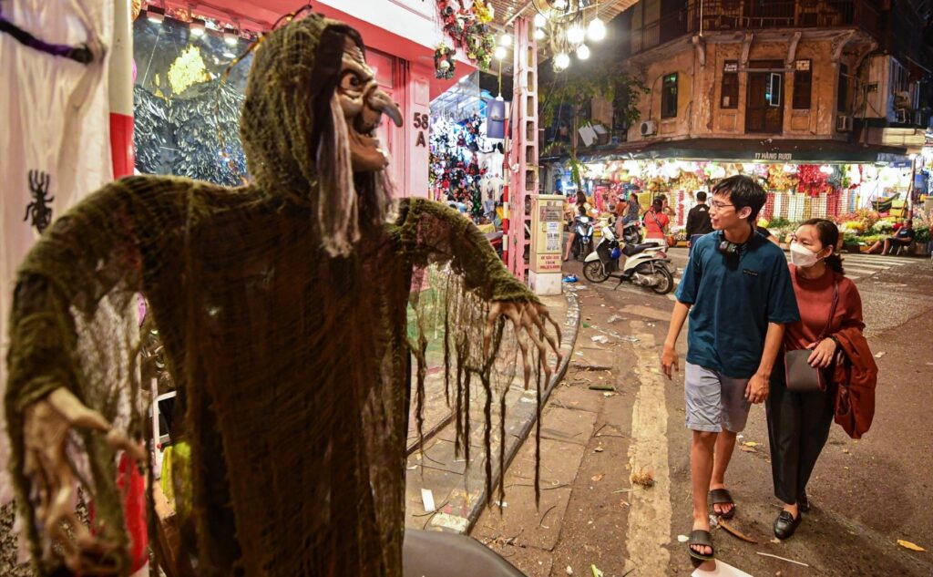 The streets of Hanoi are filled with people having fun wearing horror costumes on Halloween - Celebrating Halloween In Vietnam 2023 | A Spooktacular Guide