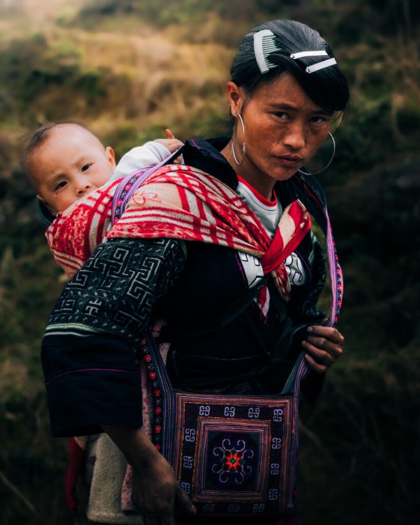 A HMong woman and her son. Photo by VIA Ambassador Le Van Anh Tai - What To Do In North Vietnam: Navigate Your Dream Itinerary