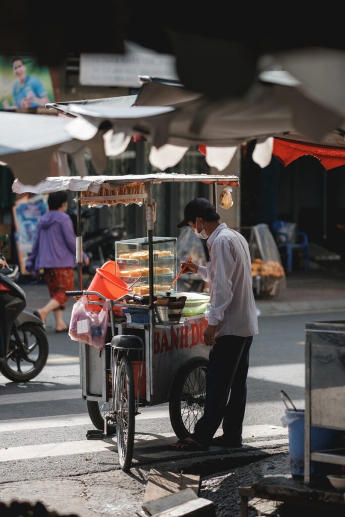 A street food vendor in District 5. Photo by VIA Ambassador Adrien Jean - Top Cities in South Vietnam: The Ultimate Travel Guide