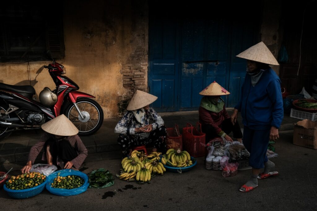 11 Delicious Hoi An Food Experiences To Satisfy Your Cravings in 2024 15 Fruit selling on Hoi An street. Photo by VIA Ambassador Etienne Bossot - 11 Delicious Hoi An Food Experiences To Satisfy Your Cravings in 2024