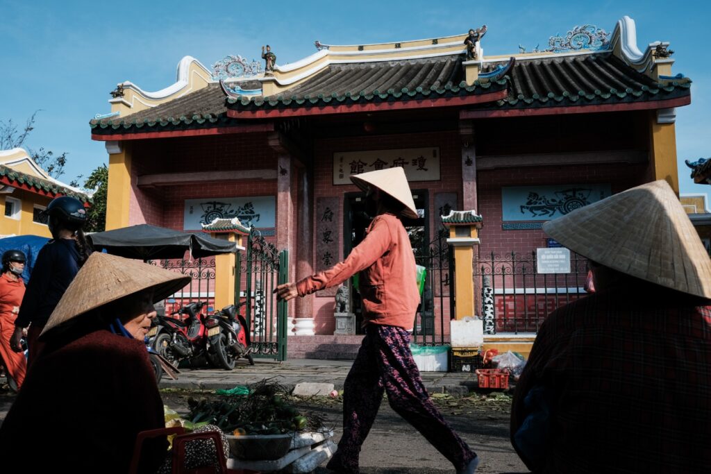 Central Vietnam Guide: 7 Must-Visit Destinations Await! 13 Street Merchants beside an old pagoda in Hoi An Ancient Town. Photo by VIA Ambassador Etienne Bossot - Central Vietnam Guide: 7 Must-Visit Destinations Await!
