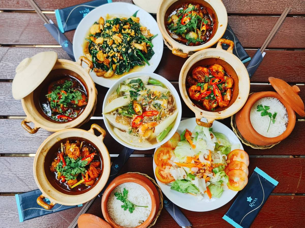 Multiple display of dishes from Am Thuc RIVIA - RIVIA Food & Dining